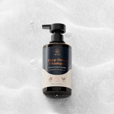 Wuli Hair Care Deep Detox Shampoo bottle on background with soap foam, an Australian-made vegan clarifying wash for natural curly and wavy hair