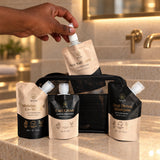 Wuli Travel Kit pouches and toiletry bag on a hotel bathroom vanity